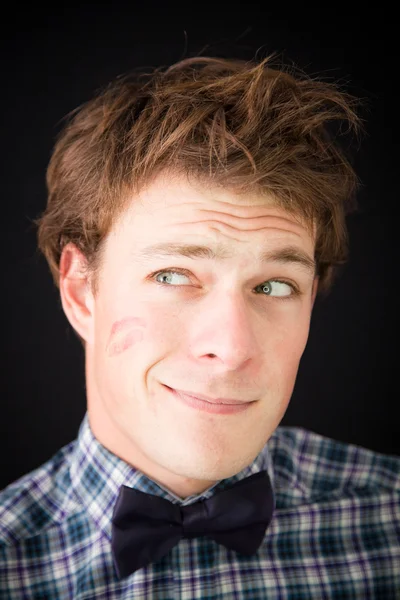 A fun young man with a trace of lipstick on his cheek — Stock Photo, Image