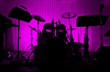 Drum in silhouette with no musician. clipart