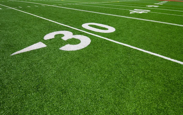 Thirty yard line - football with natural lighting Stock Image