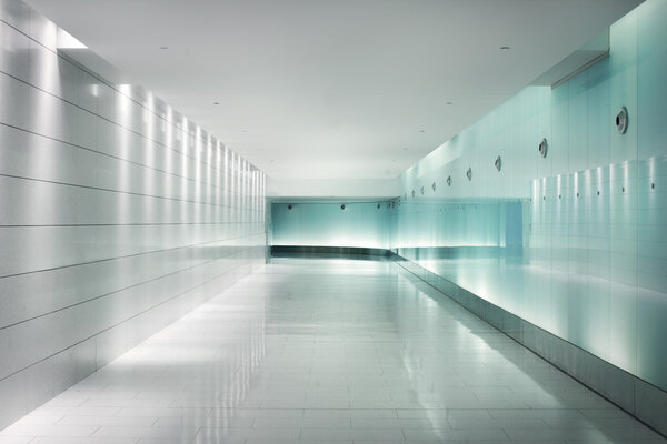 Glass walls in an underground corridor in futuristic style
