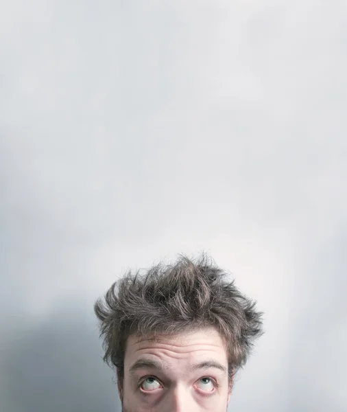 Young man just woke up on a white background — Stock Photo, Image