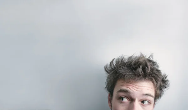 Young man just woke up on a white background — Stock Photo, Image