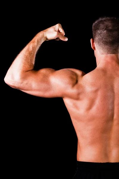 Svalnatý kulturista biceps — Stock fotografie