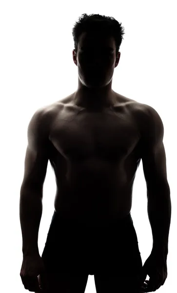 Muscular man in silhouette — Stock Photo, Image