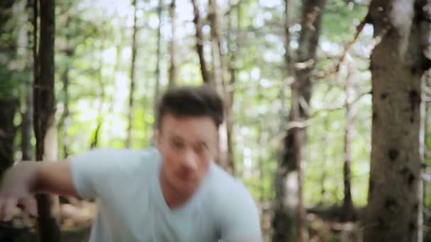 Scared young man in the woods — Stock Video