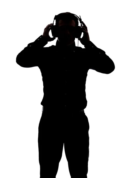 Hombre escuchando música con auriculares —  Fotos de Stock