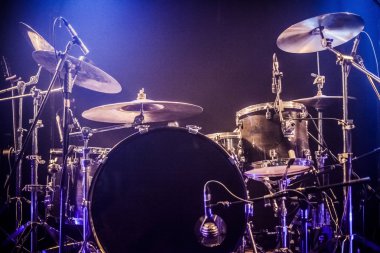 Drumkit on empty stage waiting for musicians clipart