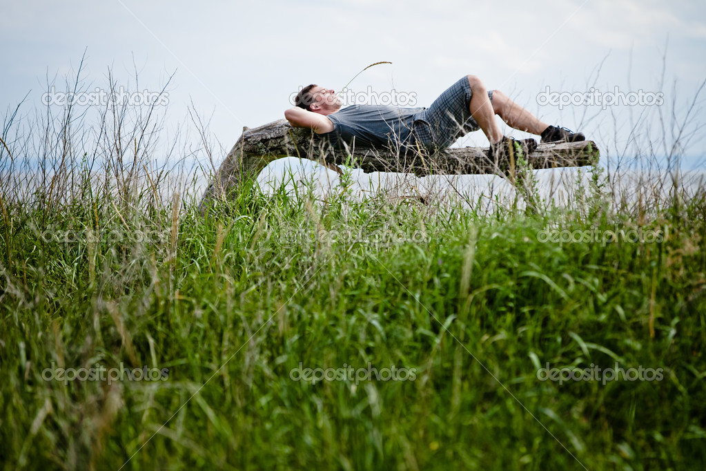 Young Adult Relaxing Peacefully in Nature