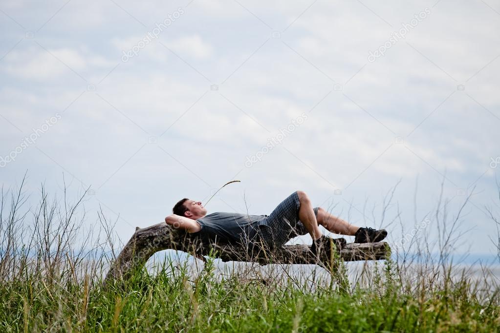 Young Adult Relaxing Peacefully in Nature