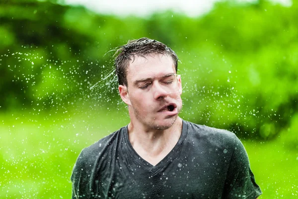 Young Adult Completely Drenched Shaking His head Royalty Free Stock Images