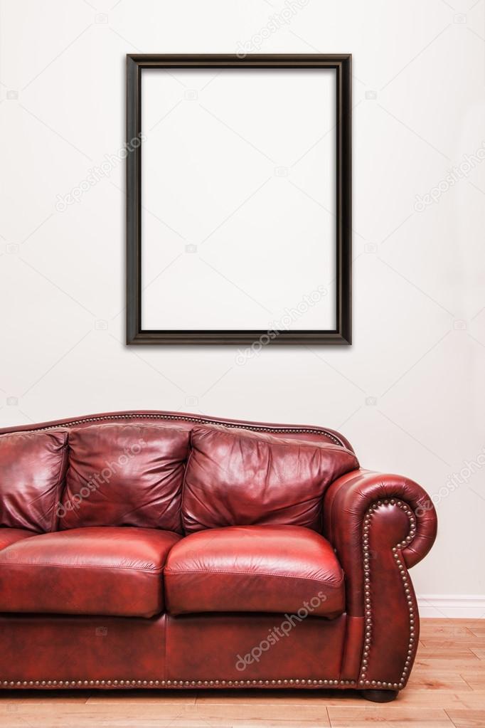 Luxurious Red Leather Couch in front of a blank frame to ad your text, logo, images, etc.