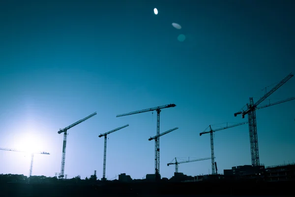 Crane Silhouette of a big Construction Site — Stock Photo, Image