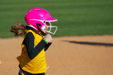 Softball Player Looking Surprised at the Play clipart