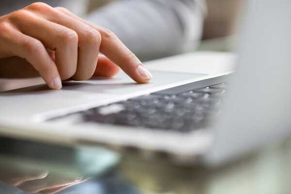 Woman using laptop at indoor.close-up