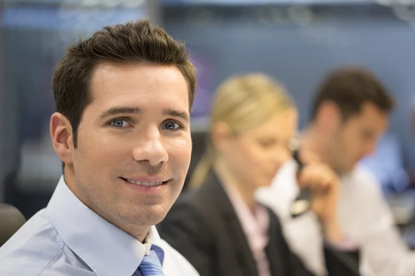 Smiling businessman in office — Stock Photo, Image