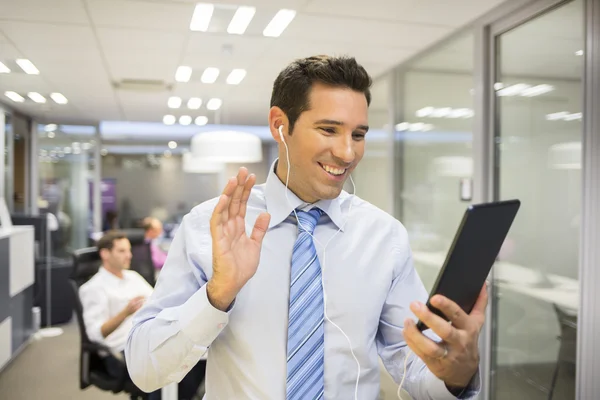 Businessman chatting with tablet PC — Stock Photo, Image