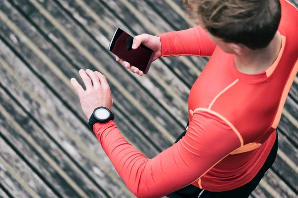Running Man Checking Sport Performance His Mobile Phone Smartwatch App — Zdjęcie stockowe