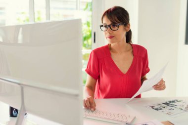 Pretty mature confident woman at white office business company
