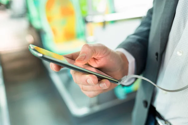 Man Listening Music Mobile Phone Bus Texting Message Close Hands — Stockfoto