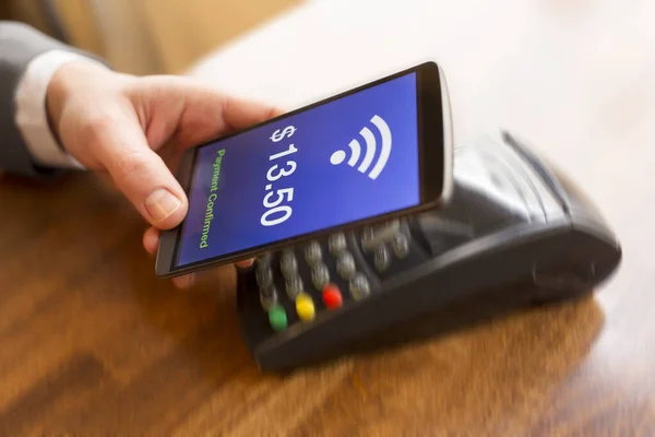 Man Paying Nfc Technology Mobile Phone Dollar Version Motion Hand — Stockfoto