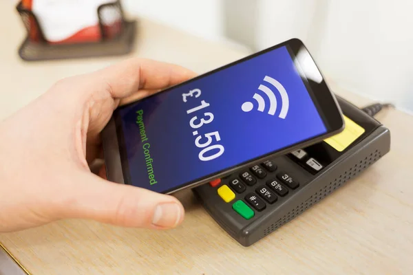 Man Paying Nfc Technology Mobile Phone Pound Version — стокове фото