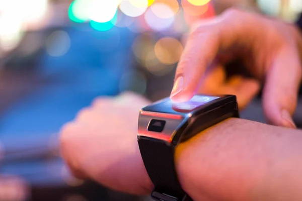 Man Using His Smart Watch App Street Night Light Bokeh — Stock Photo, Image