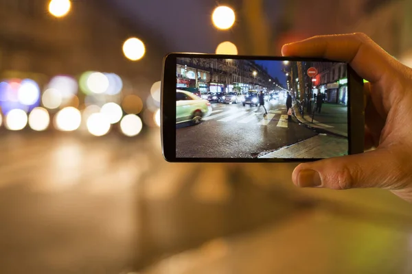 Man Makes Picture Street His Mobile Phone Night Light Bokeh — Stock Photo, Image