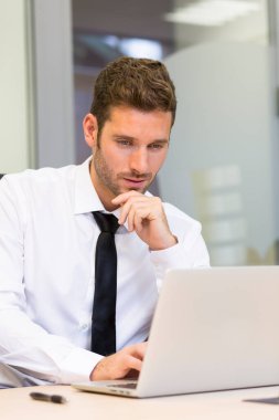 Businessman working on computer in modern office