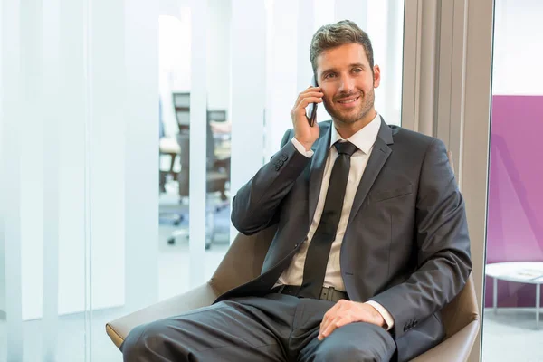 Businessman Cell Phone Seated Lounge — Stock fotografie