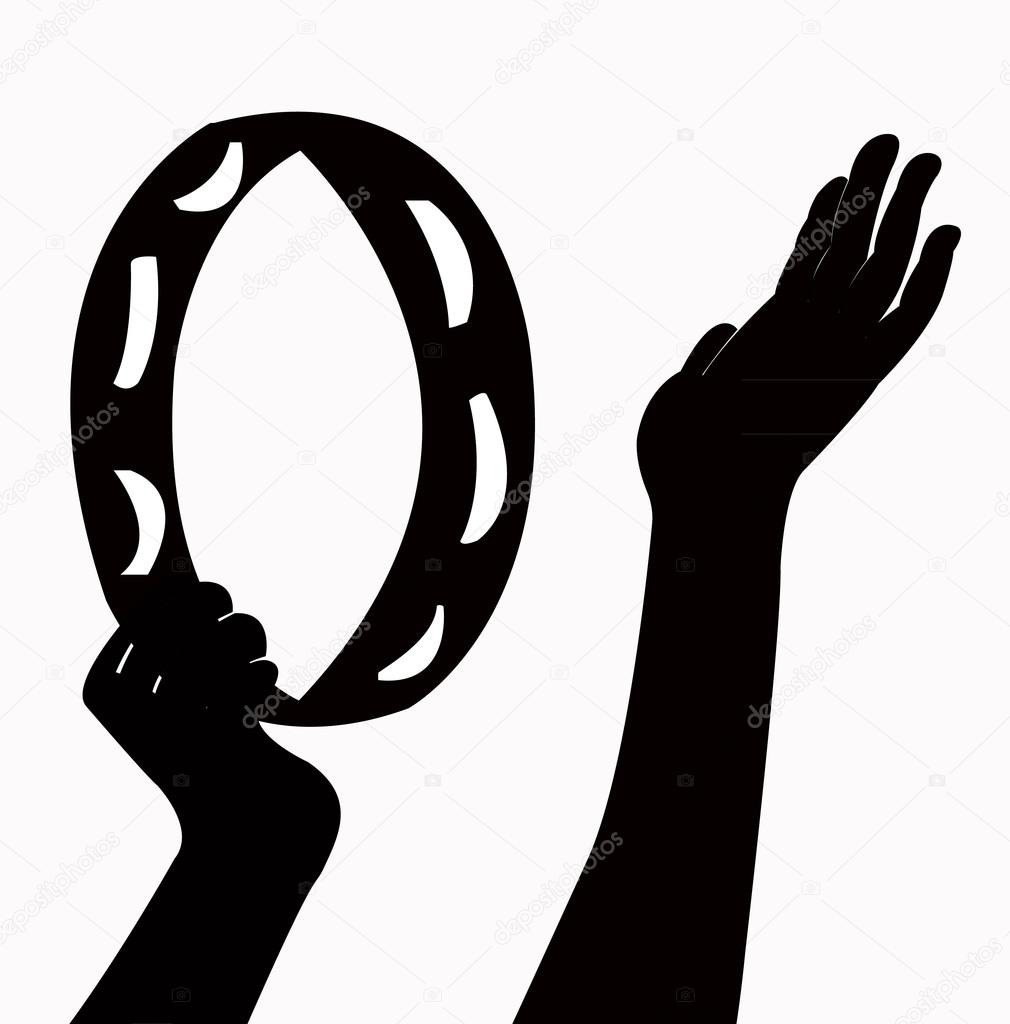 Hands playing tambourine