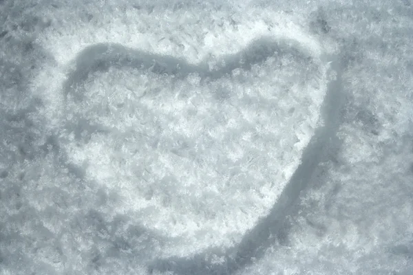 Heart shape on icy snow — Stock Photo, Image