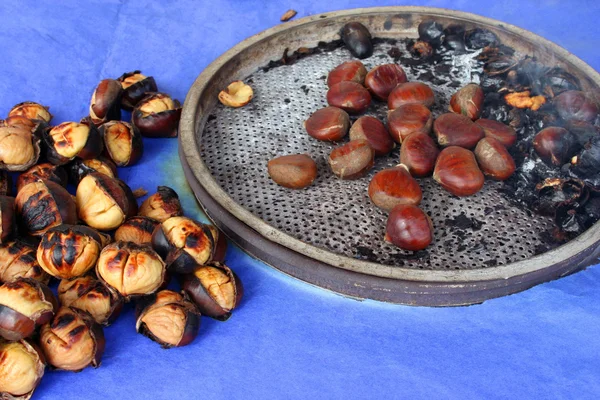 Delicious grilled chestnuts as background — Stock Photo, Image
