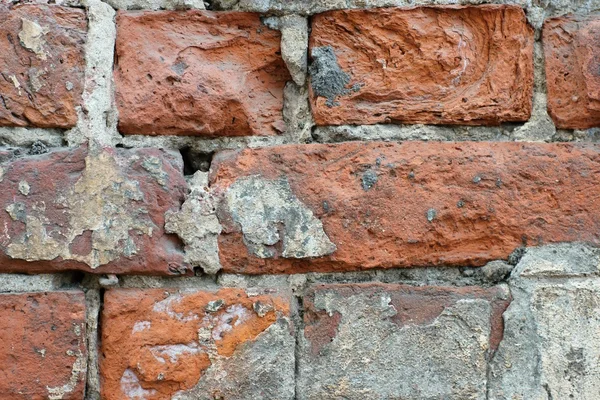 De oude bakstenen muur wordt samengevouwen — Stockfoto