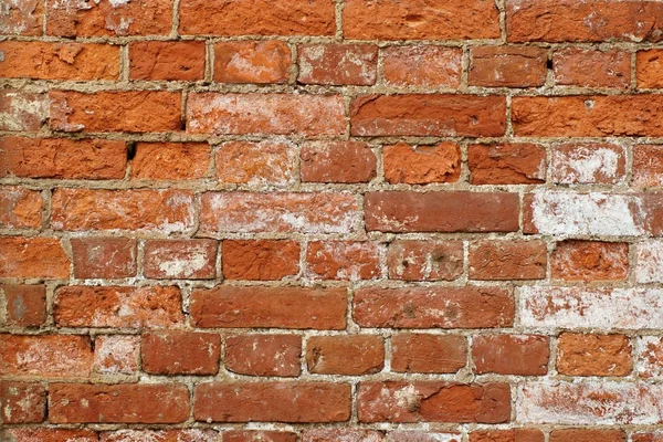 Oude muur van een rode bakstenen — Stockfoto