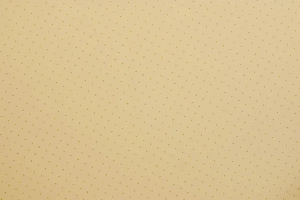 Beige background in a speck — Stock Photo, Image