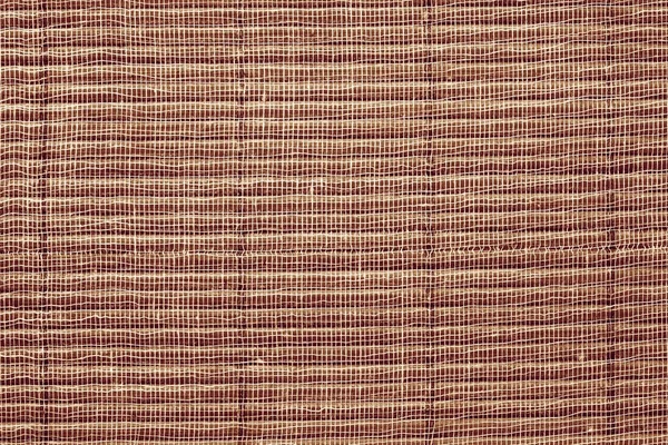 Texture of a brown straw mat — Stock Photo, Image
