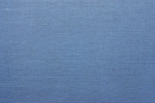 Die granulierte Textur eines blauen Materials — Stockfoto