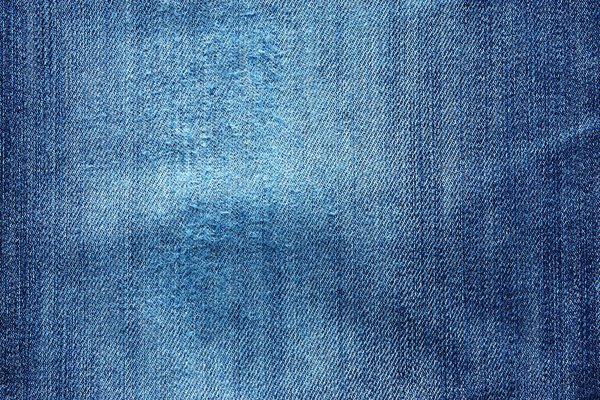 Внешняя текстура вытертых и скомканных джинсов
