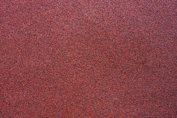 Fijnmazig textuur van een rode schurend materiaal — Stockfoto