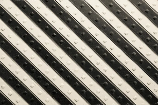 Panel mit schwarz beige schräg gestreiftem Muster — Stockfoto