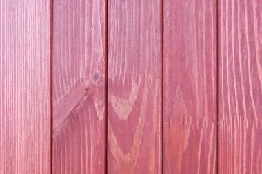 the textured wooden surface of claret color