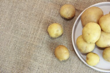 fresh yellow potato fruit on a plate