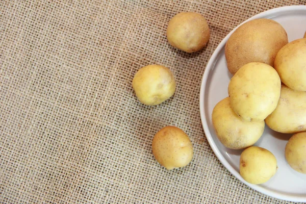 fresh yellow potato fruit on a plate