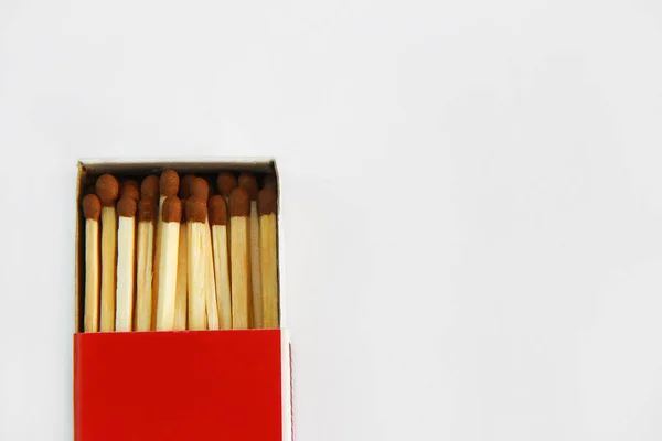 wooden matches for lighting in a cardboard box