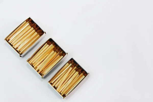 wooden matches for lighting in a cardboard box