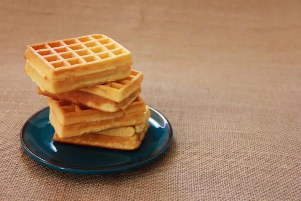 Sweet Fluted Belgian Waffles Blue Plate Brown Background — Stock Fotó