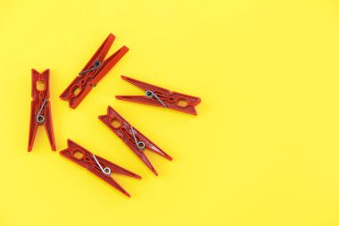 plastic clothespins for fastening clean laundry on a rope