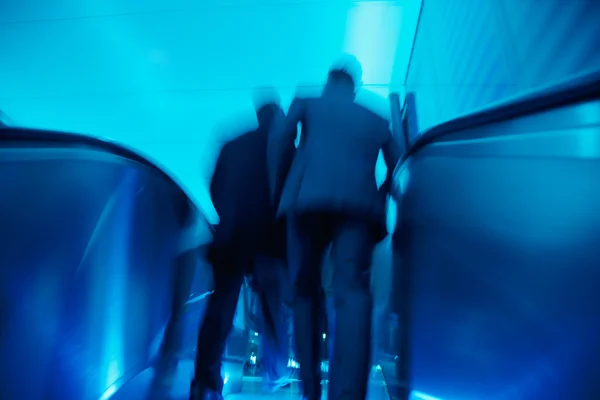 Businesspeople Leaving an Office Building, Motion Blur