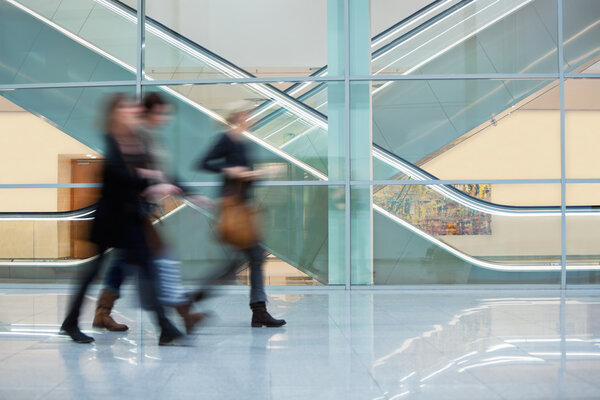 Trade Fair Visitors Walking Along Modern Corridor