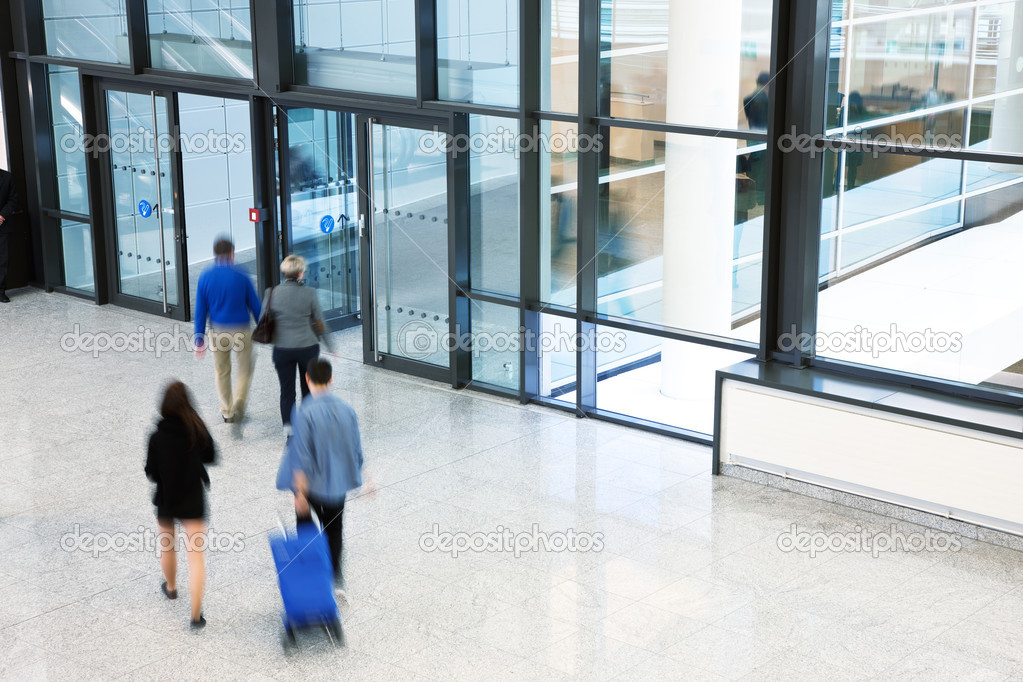Businesspeople Rushing through Corridor, Motion Blur